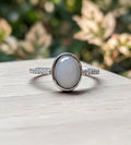 Silver ring with a large stone on a wooden surface with a blurred natural background.
Ellie- Milky Way Spirit & Soul Keepsakes 
