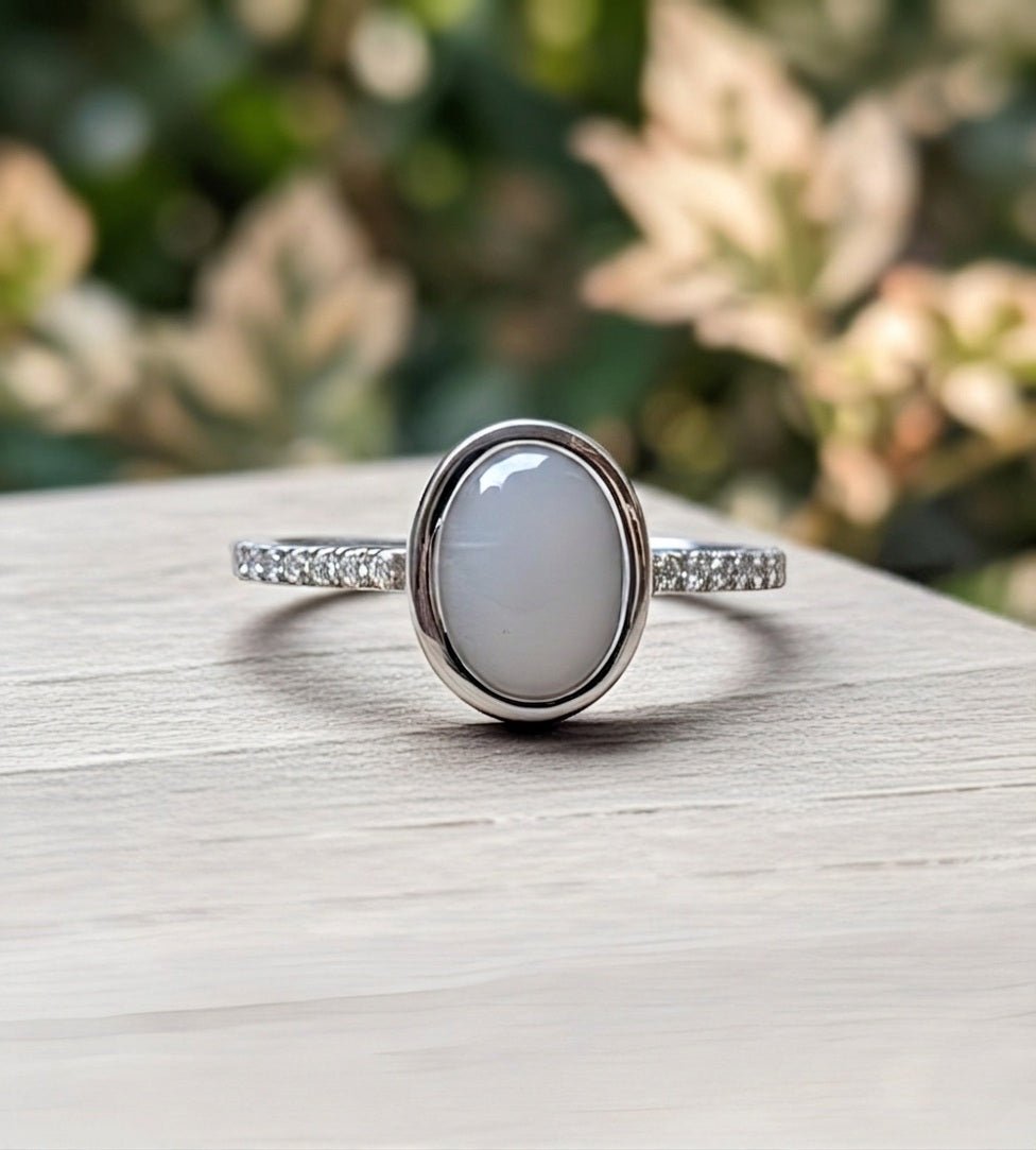 Silver ring with a large stone on a wooden surface with a blurred natural background.
Ellie- Milky Way Spirit & Soul Keepsakes 