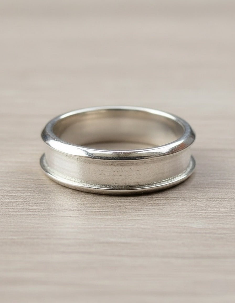 Silver inlay ring on a beige surface
Milky Way Spirit & Soul Keepsakes 